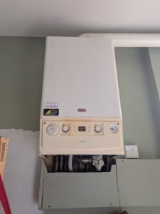 Old Alpha combi boiler before replacement on New Street, Idle BD10